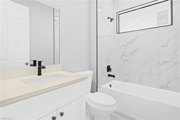 Full bathroom featuring vanity and bathtub / shower combination