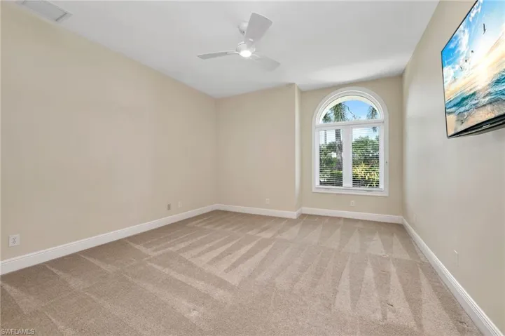 Guest Bedroom with light carpet with ensuite