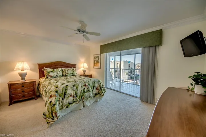 Master bedroom with master bath , walk-in closet, water and gulf views