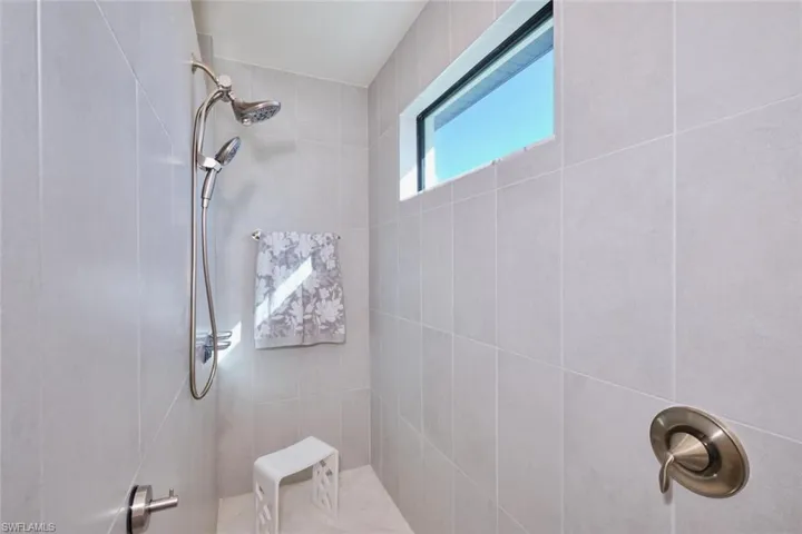 Primary Bathroom with walk-in Shower tiled from floor to ceiling