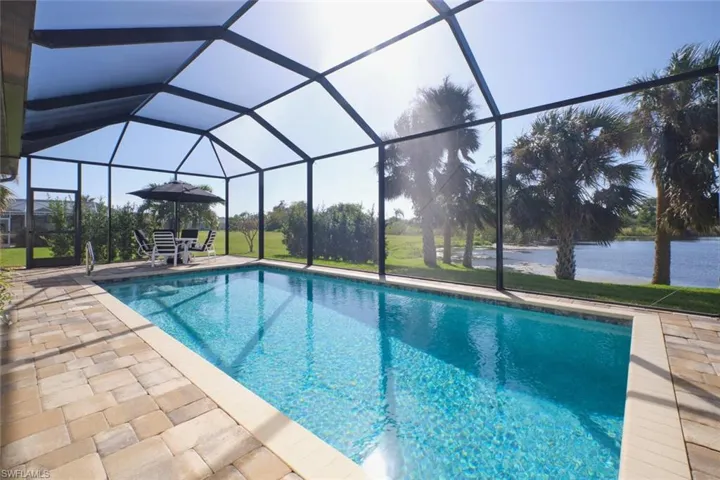 View of pool, lanai, and   Pond View