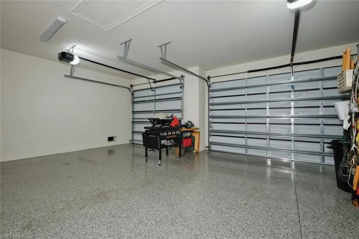 3 Car Garage featuring a side Serice door and Epoxy Coated Floors