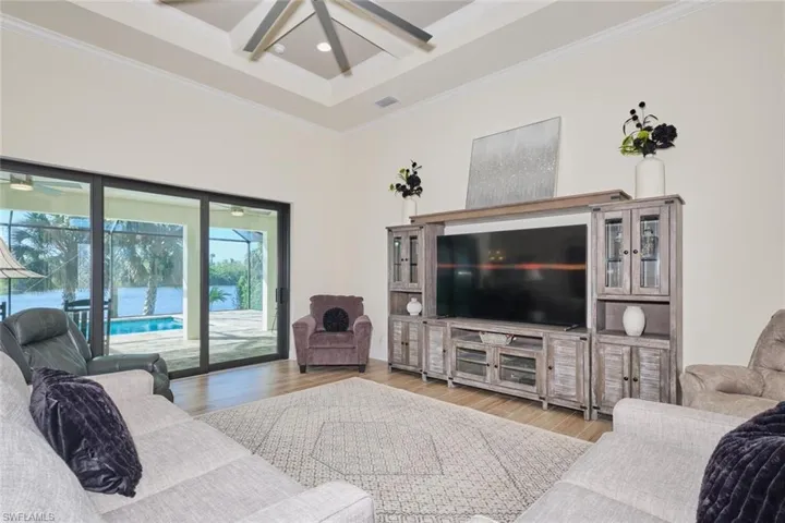 Great Room with Coffered Ceiling and Giant ceiling Fan