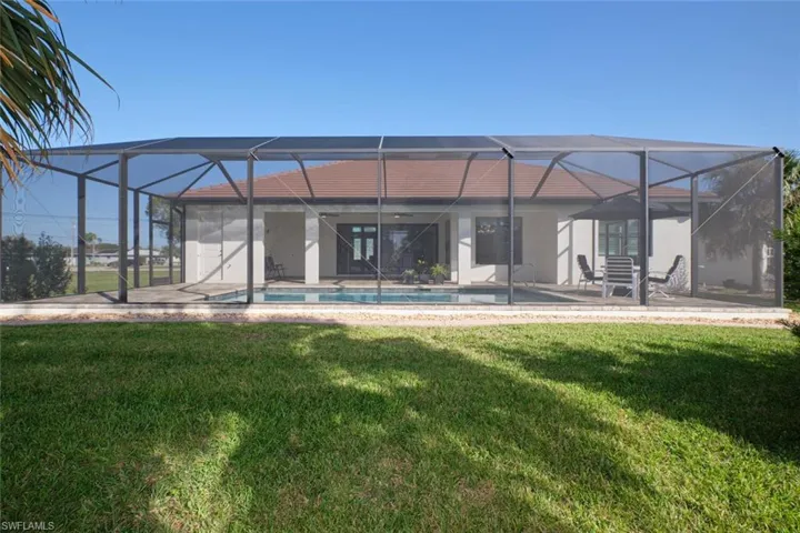 Rear view of house and pool area