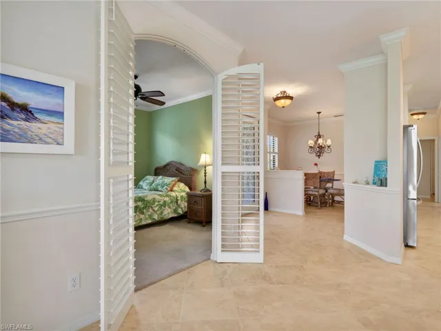 Dining Area and Den/Flex Room with Ceiling Fan & Plantation Shutter Doors (Currently Used as a Third Bedroom)