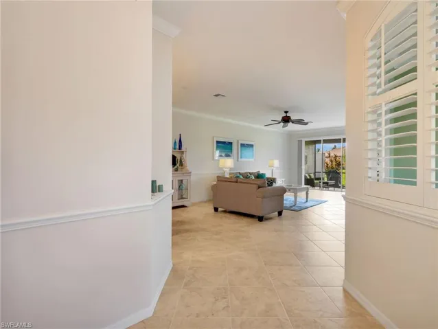 Front Entryway  eading to the Living Area & Den with Crown Molding Throughout