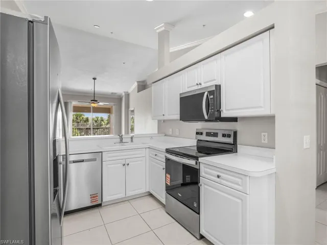 Kitchen With Brand New SS Whirlpool Appliances