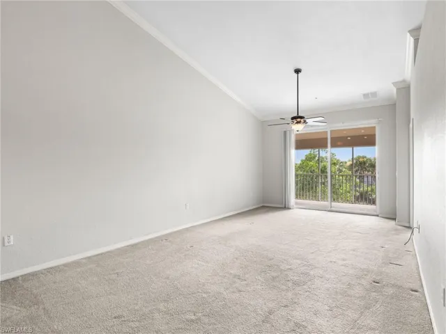 Great Room with Vaulted Ceilings and Sliding Doors to Screened In Lanai
