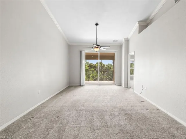 Great Room with Vaulted Ceilings and Sliding Doors to Screened In Lanai