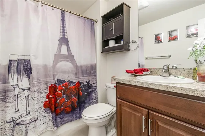 Full bath with toilet and vanity