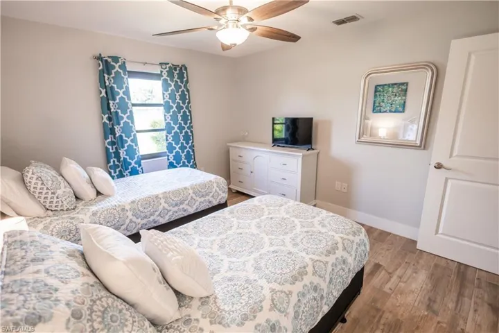 Bedroom featuring light wood-type flooring and a ceiling fan