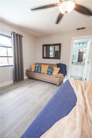Living room with a ceiling fan and wood finished floors