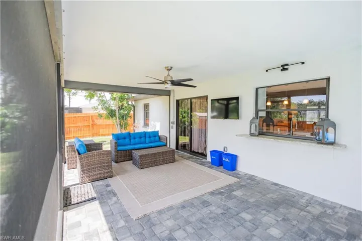 View of patio featuring an outdoor living space and a ceiling fan