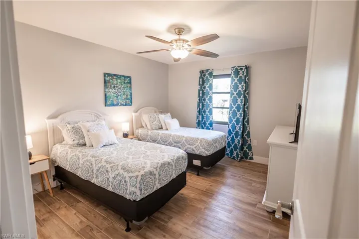 Bedroom featuring light wood-style flooring and ceiling fan