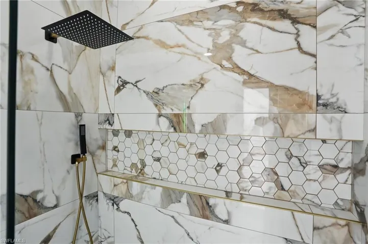 Bathroom view of a marble finish shower