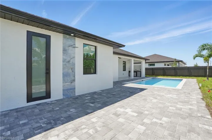 View of pool featuring a patio area and a fenced backyard