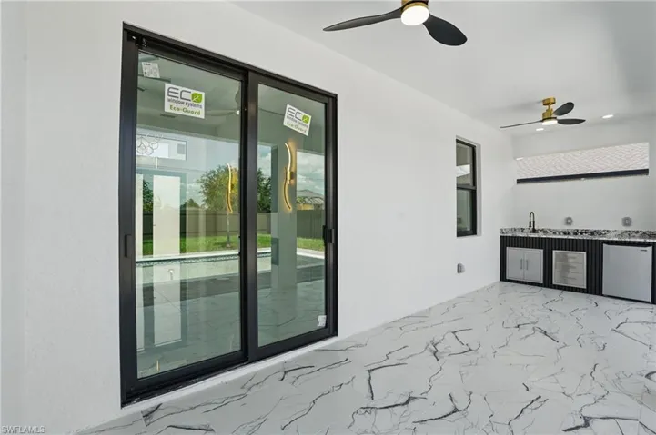 View of patio / terrace featuring ceiling fan and exterior kitchen