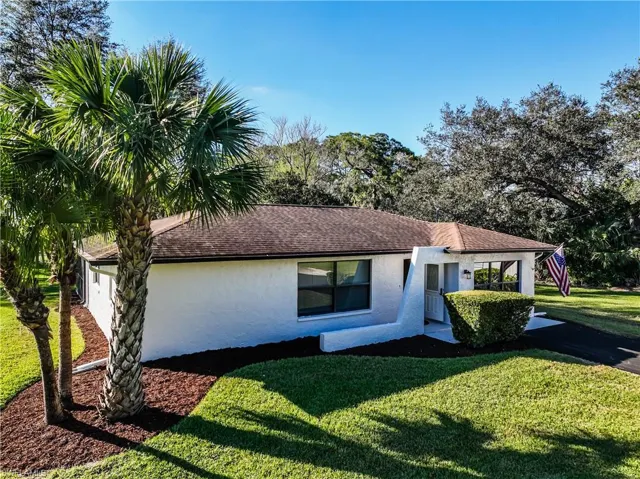 View of front of property with a front lawn