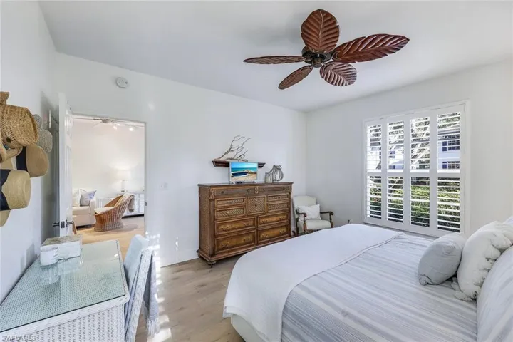 Bedroom with light wood-type flooring and ceiling fan