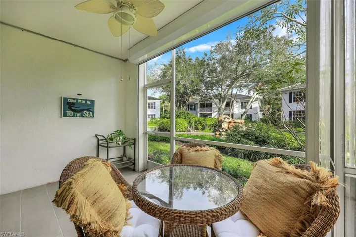 Sunroom featuring ceiling fan