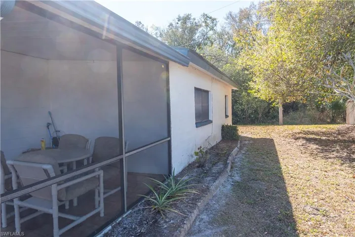 View of home's exterior with a sunroom
