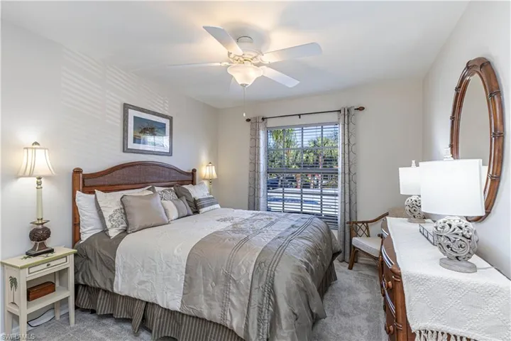 Carpeted bedroom with ceiling fan