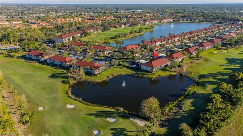 Drone / aerial view of lake and 14th hole/fairway