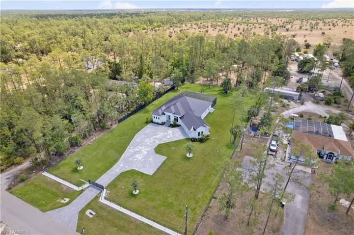 View of property location featuring a heavily wooded area