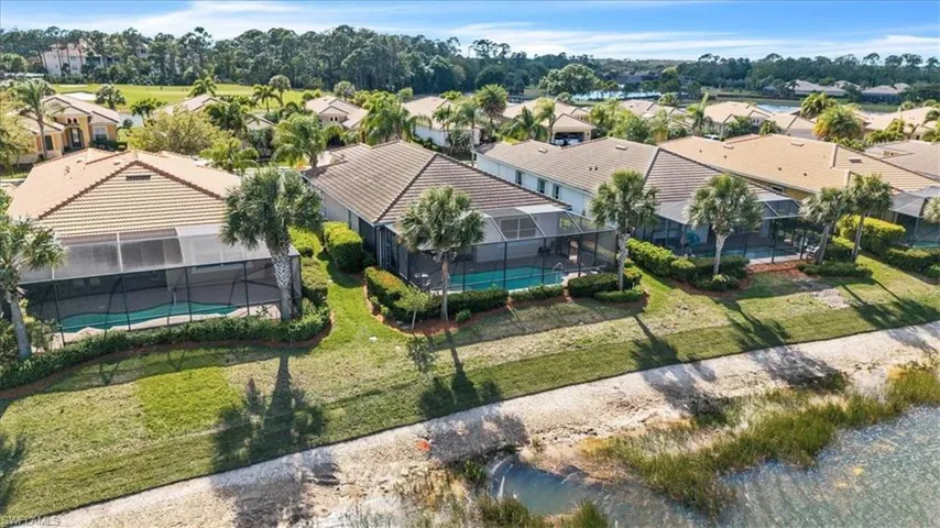 Aerial view of residential area featuring a pool area