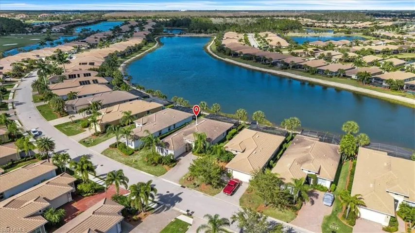 Aerial view of residential area with a large body of water