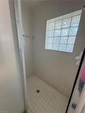 Full bathroom with a stall shower