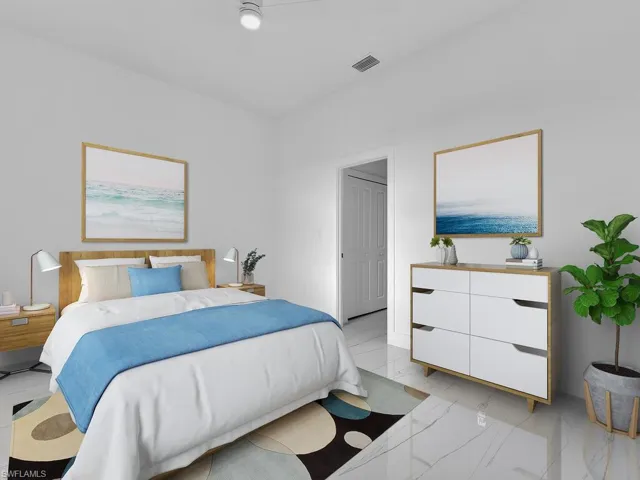 Bedroom with a closet and light tile floors