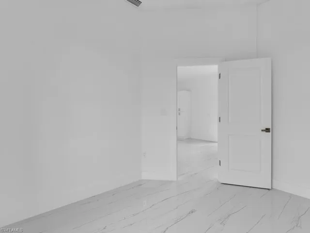 Spare room featuring light tile floors