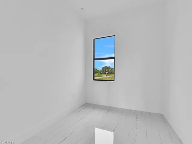 Unfurnished room featuring light wood-type flooring