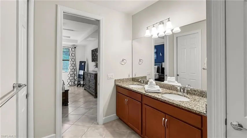 Bathroom featuring vanity and tile patterned floors
