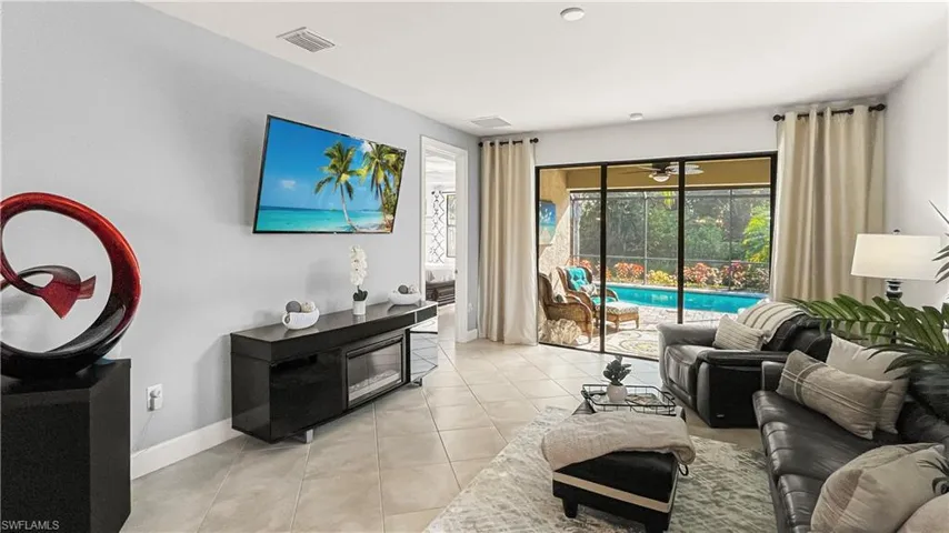 Tiled living room with ceiling fan