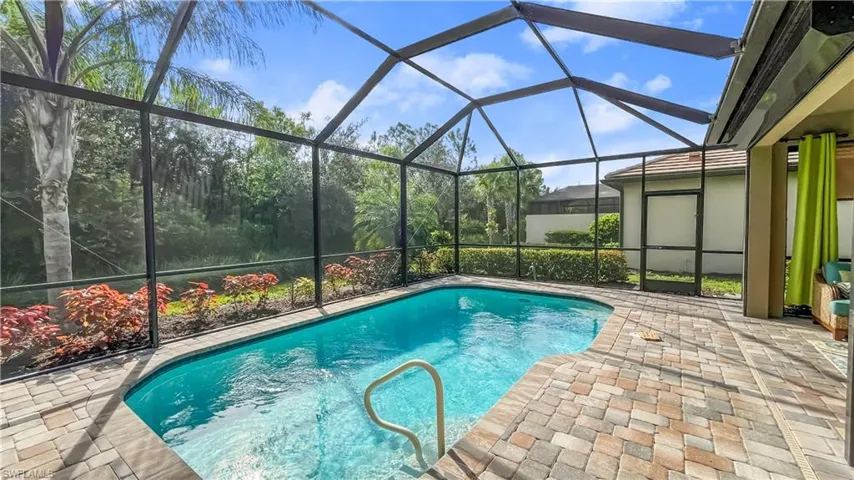 View of pool featuring a lanai and a patio area