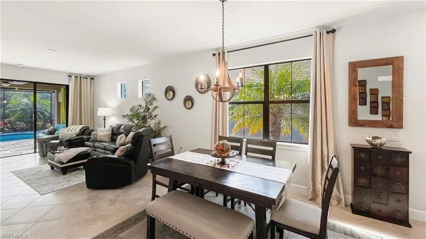 Dining area featuring light tile patterned floors and a healthy amount of sunlight