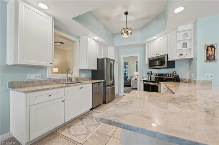 28100 Cetation Way Bonita Springs FL - Open kitchen with stainless appliances and granite countertop