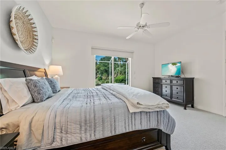 28100 Cetation Way Bonita Springs FL - Owner's bedroom with slider access to pool deck