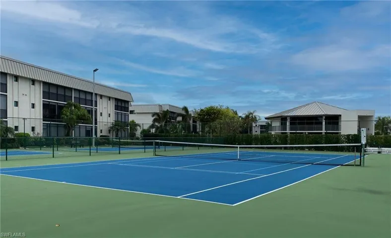 View of tennis court featuring community basketball court