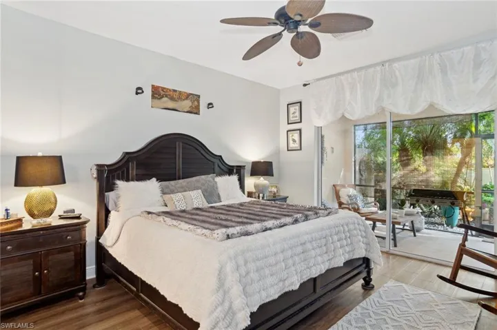 Bedroom featuring access to outside, ceiling fan, and wood-type flooring