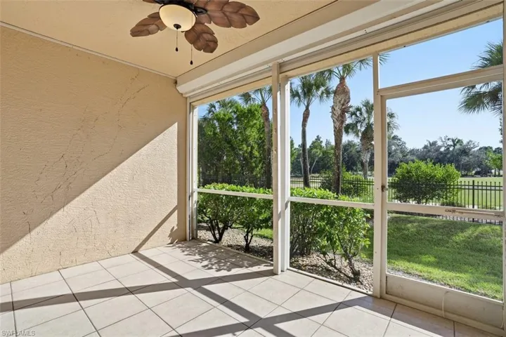 Unfurnished sunroom with a ceiling fan