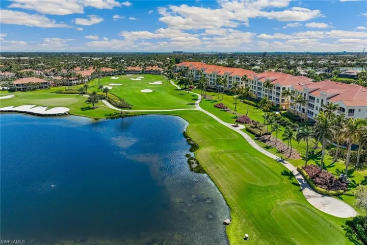 Drone / aerial view featuring view of golf course and a water view