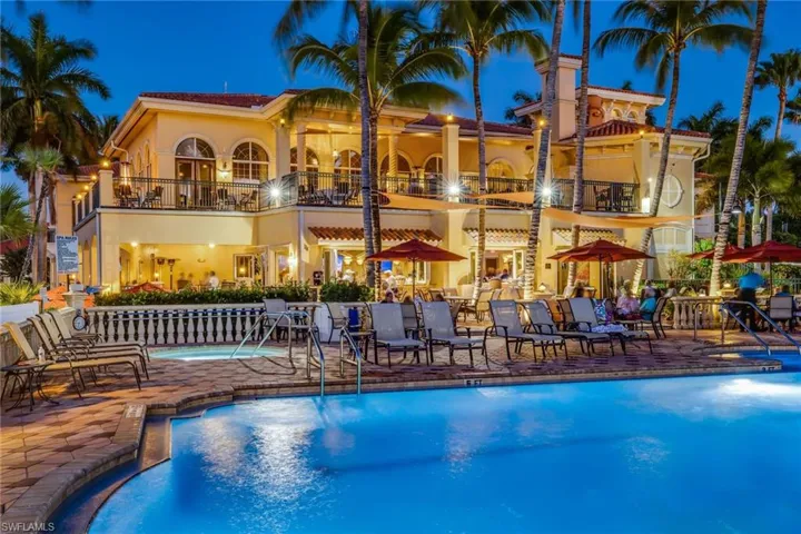 Pool with a patio area and a community hot tub