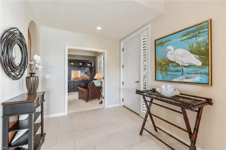 Entrance foyer featuring recessed lighting and baseboards