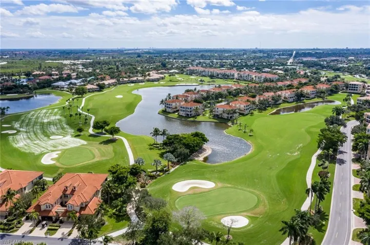Drone / aerial view with a water view and golf course view