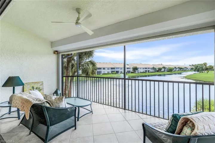Screened Lanai featuring ceiling fan and a water and golf views.