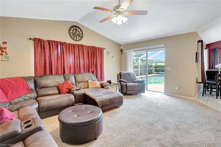 Large great room leading to outdoor entertaining area.