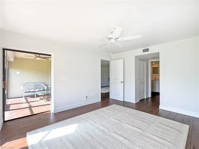 Master Bedroom with access to lanai and view into Master Bath and Walk in Closet area
